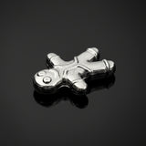 Silver charm shaped like a stick figure on a light gray background