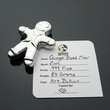 Silver gingerbread man figurine on a label with product details.