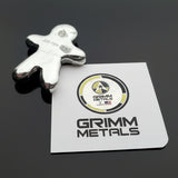 Silver figurine on a card with Grimm Metals branding