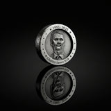 Zinc round with engraved portrait and text on a white background
