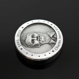 Zinc round with engraved portrait on a black background