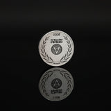 Zinc round with a logo on a black background